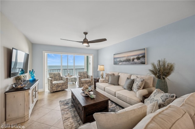 living room featuring ceiling fan and light tile patterned floors