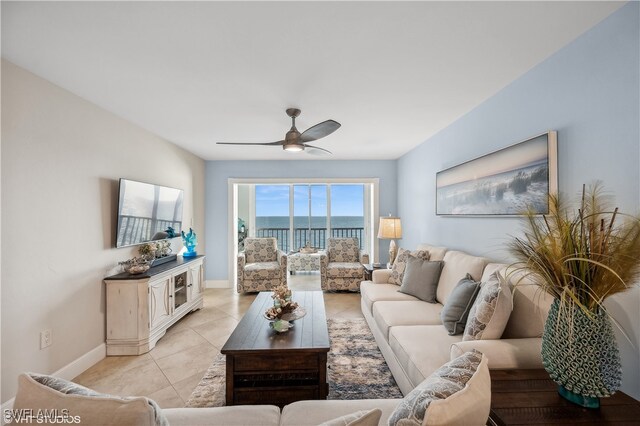 living room featuring ceiling fan and light tile patterned floors