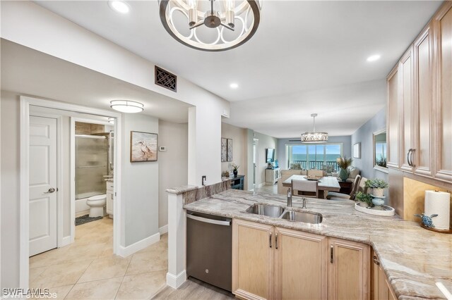 kitchen with dishwasher, sink, a chandelier, decorative light fixtures, and light brown cabinetry