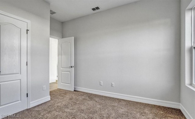 unfurnished bedroom with light carpet