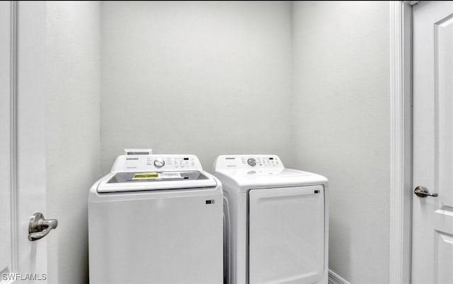 laundry area with washing machine and dryer