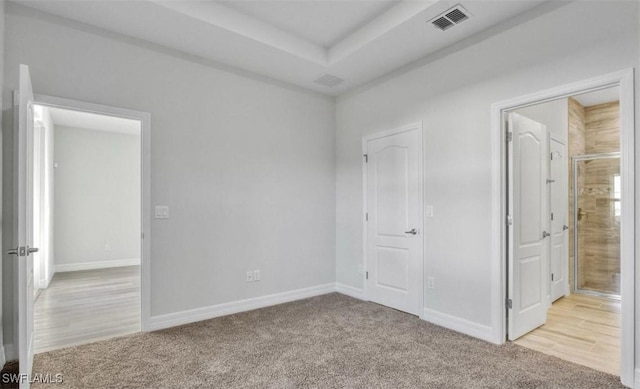 unfurnished bedroom with light carpet