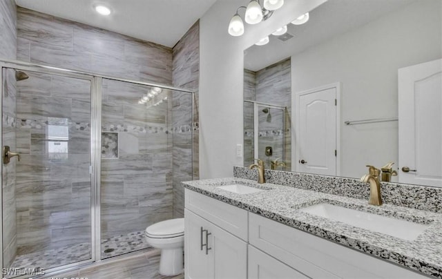 bathroom featuring hardwood / wood-style floors, vanity, toilet, and an enclosed shower