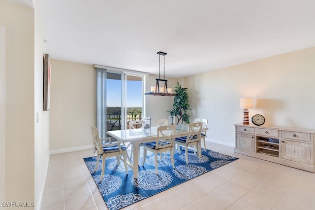 dining space featuring light tile patterned floors