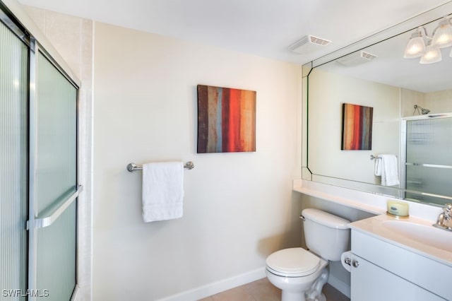 bathroom with vanity, walk in shower, toilet, and tile patterned floors