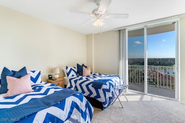 bedroom featuring light carpet, expansive windows, access to exterior, and ceiling fan