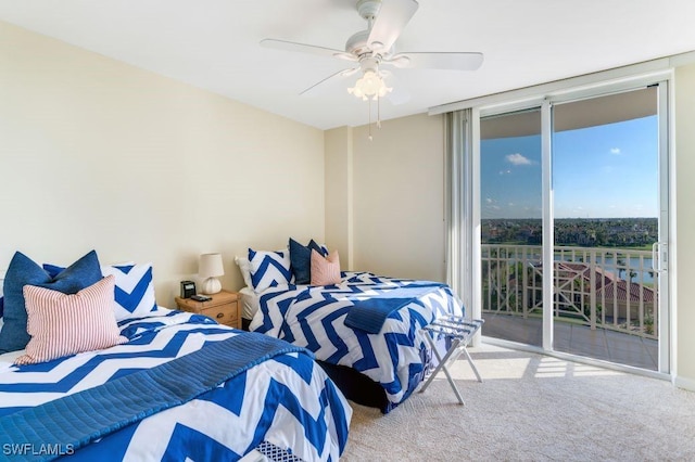 carpeted bedroom with access to exterior, expansive windows, and a ceiling fan