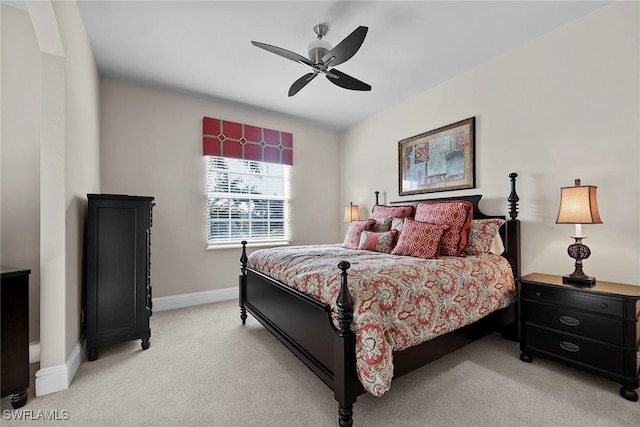 bedroom with light colored carpet and ceiling fan