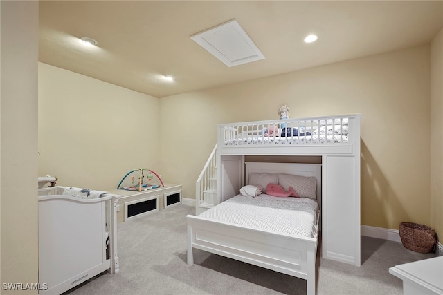 bedroom featuring light carpet