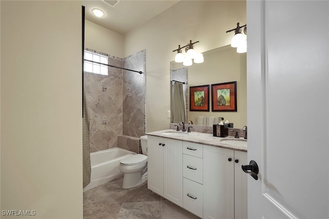 full bathroom featuring vanity, tile patterned flooring, toilet, and shower / tub combo