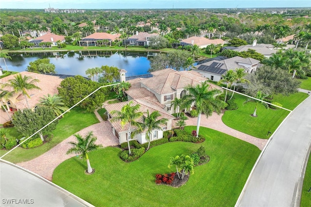 birds eye view of property featuring a water view