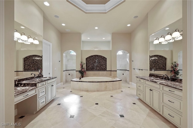 bathroom with vanity and independent shower and bath