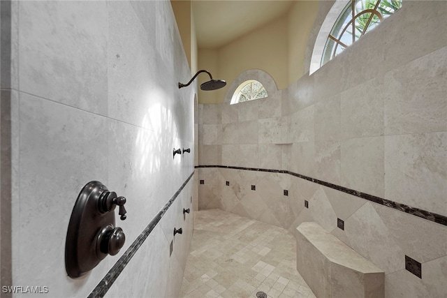 bathroom with tiled shower