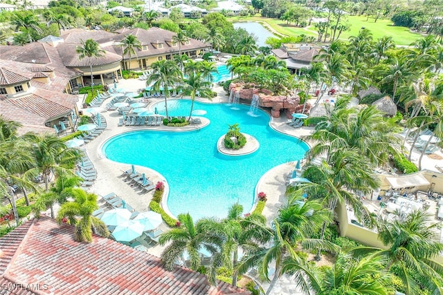 view of swimming pool featuring a patio and pool water feature