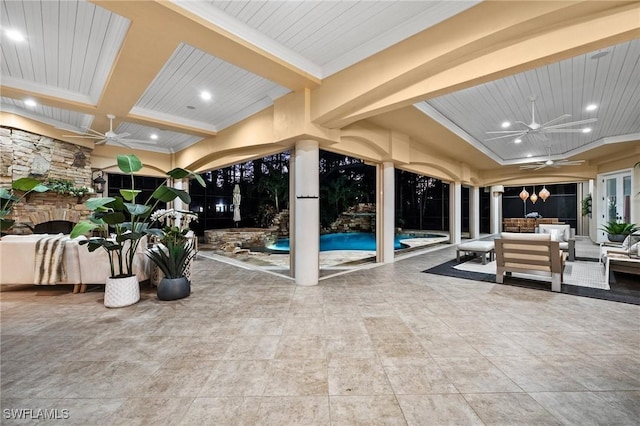 view of swimming pool featuring ceiling fan