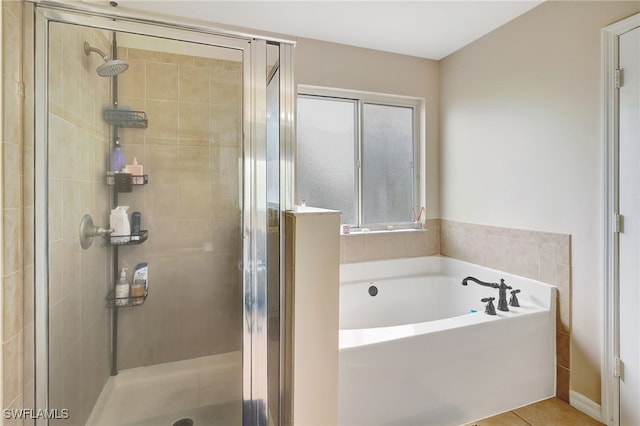 bathroom with plus walk in shower and tile patterned floors