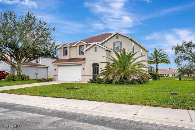 view of front of home with a front yard and a garage