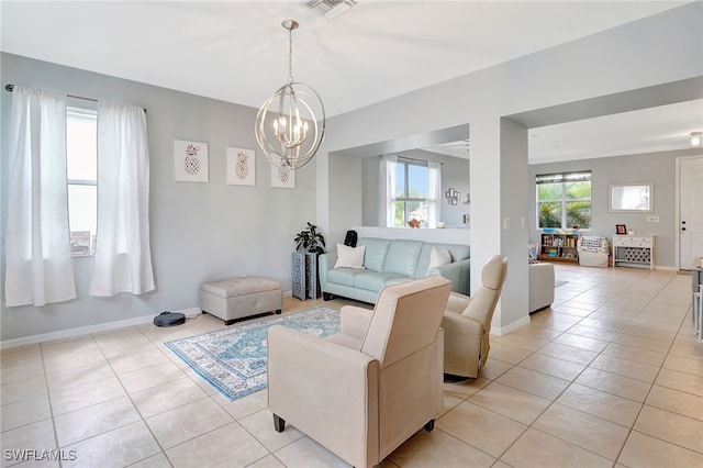 living room featuring light tile patterned flooring and a notable chandelier