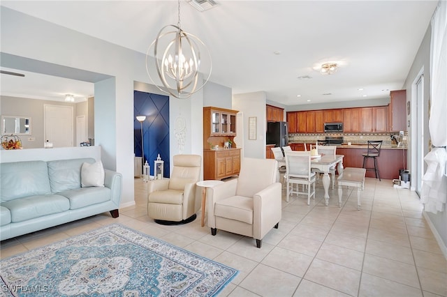 tiled living room featuring a notable chandelier