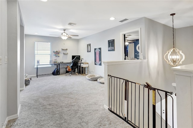 corridor featuring carpet floors and a chandelier