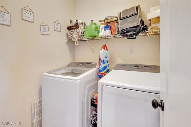 laundry room with washing machine and dryer