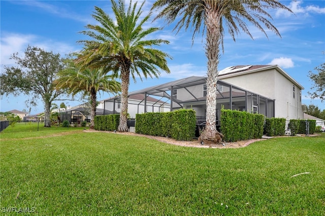 view of yard featuring glass enclosure