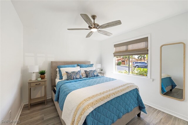 bedroom with hardwood / wood-style flooring and ceiling fan