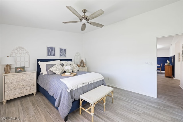 bedroom with hardwood / wood-style floors and ceiling fan