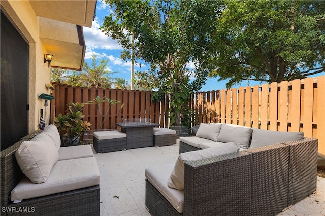 view of patio with an outdoor hangout area and a fenced backyard