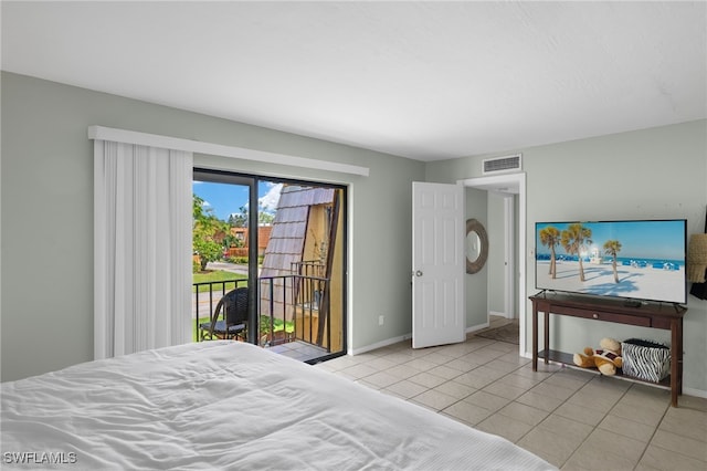 bedroom featuring light tile patterned floors, visible vents, baseboards, and access to outside