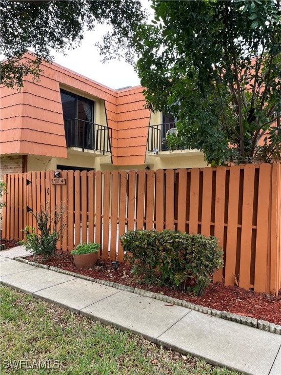 view of gate featuring fence