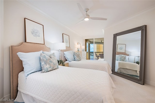 carpeted bedroom featuring ceiling fan and crown molding