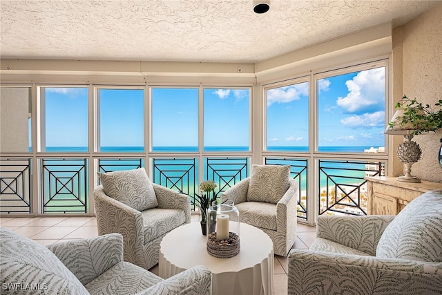 sunroom / solarium with a wealth of natural light and a water view