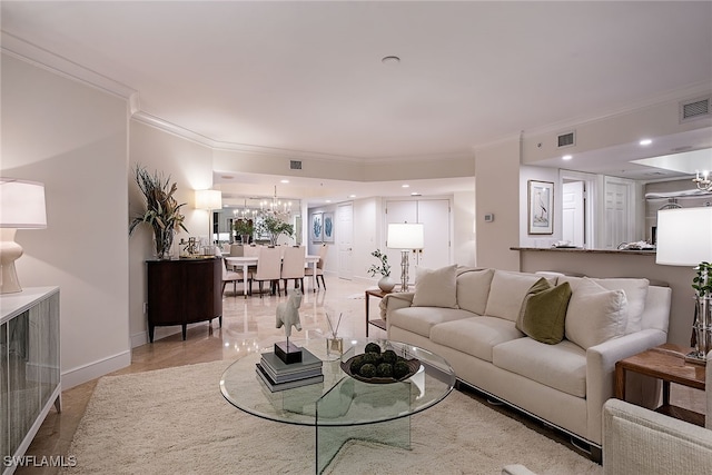 tiled living room featuring crown molding and a chandelier