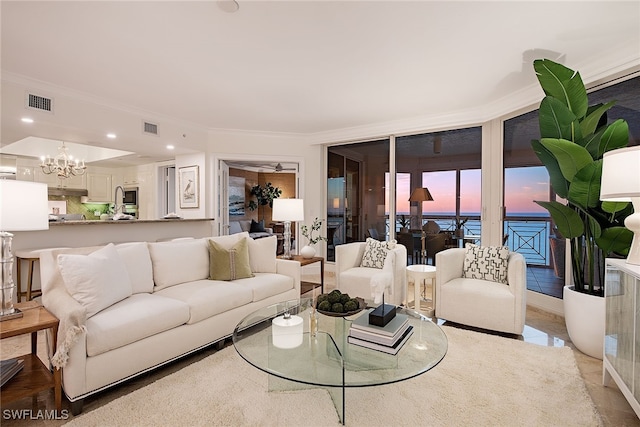 living room featuring a chandelier and ornamental molding