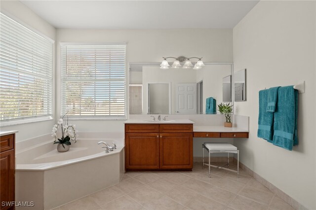 bathroom with tile patterned flooring, vanity, and shower with separate bathtub