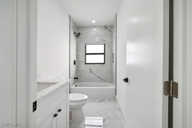 full bathroom featuring tiled shower / bath, vanity, and toilet