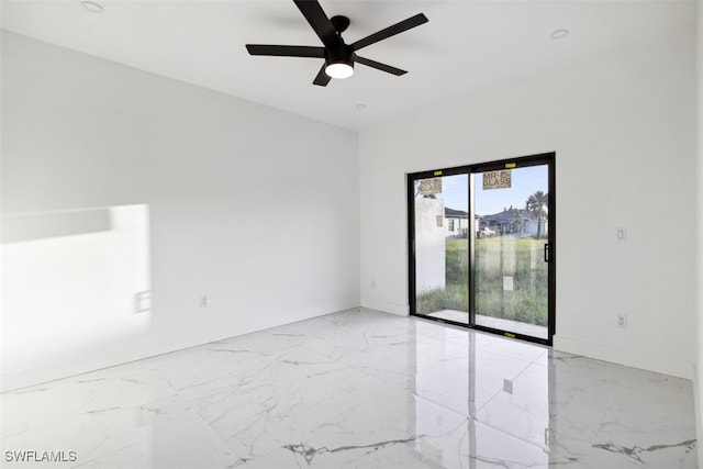 spare room with ceiling fan