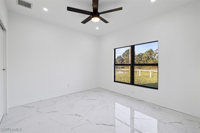 spare room featuring ceiling fan