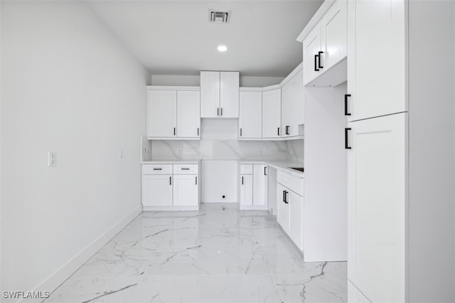 kitchen featuring white cabinets