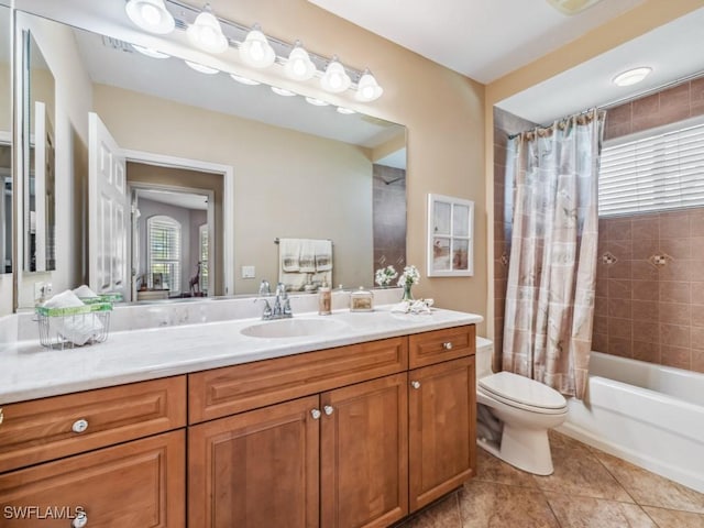 full bathroom with vanity, shower / bath combination with curtain, tile patterned floors, and toilet