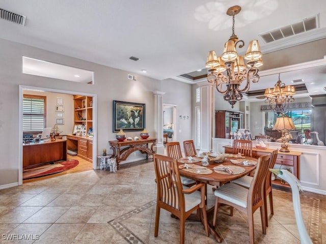 dining room featuring an inviting chandelier, light tile patterned floors, built in shelves, and ornate columns