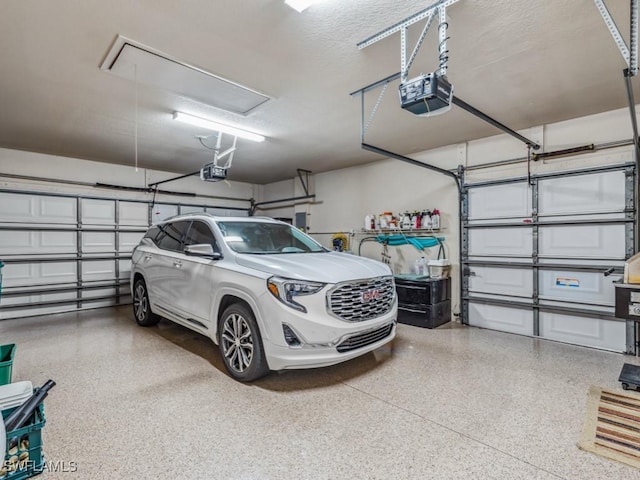 garage featuring a garage door opener