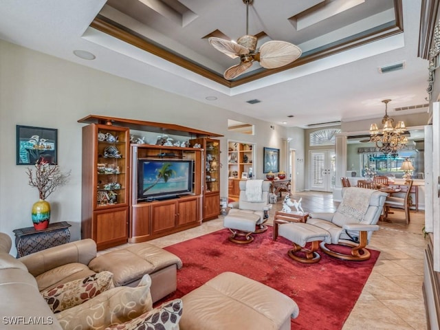 tiled living room featuring ornamental molding, coffered ceiling, and ceiling fan with notable chandelier