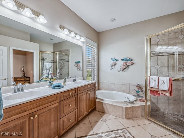 bathroom featuring tile patterned flooring, vanity, and plus walk in shower