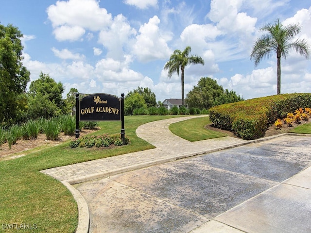 view of property's community with a yard