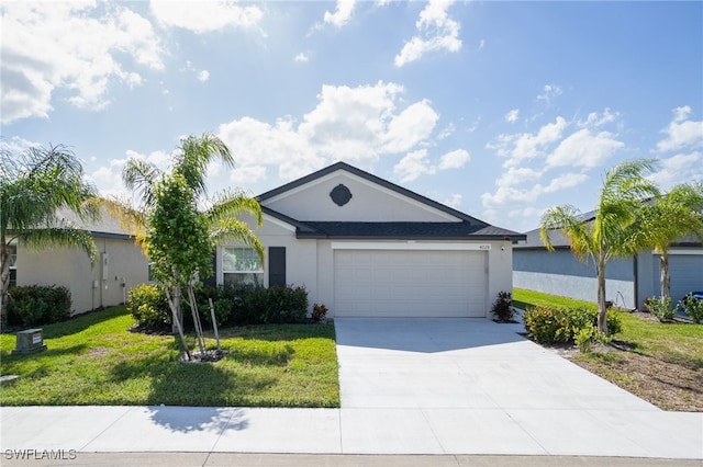 single story home featuring a front lawn and a garage