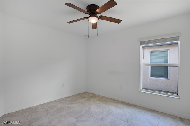 spare room with ceiling fan