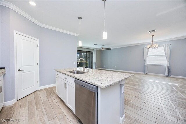 kitchen with dishwasher, sink, hanging light fixtures, white cabinets, and a kitchen island with sink