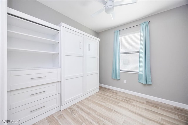 interior space with light hardwood / wood-style flooring, a closet, and ceiling fan